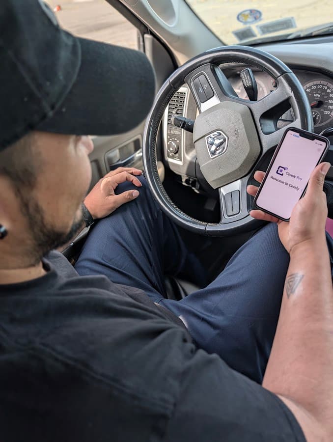 Service professional using Corely Pro from a work vehicle